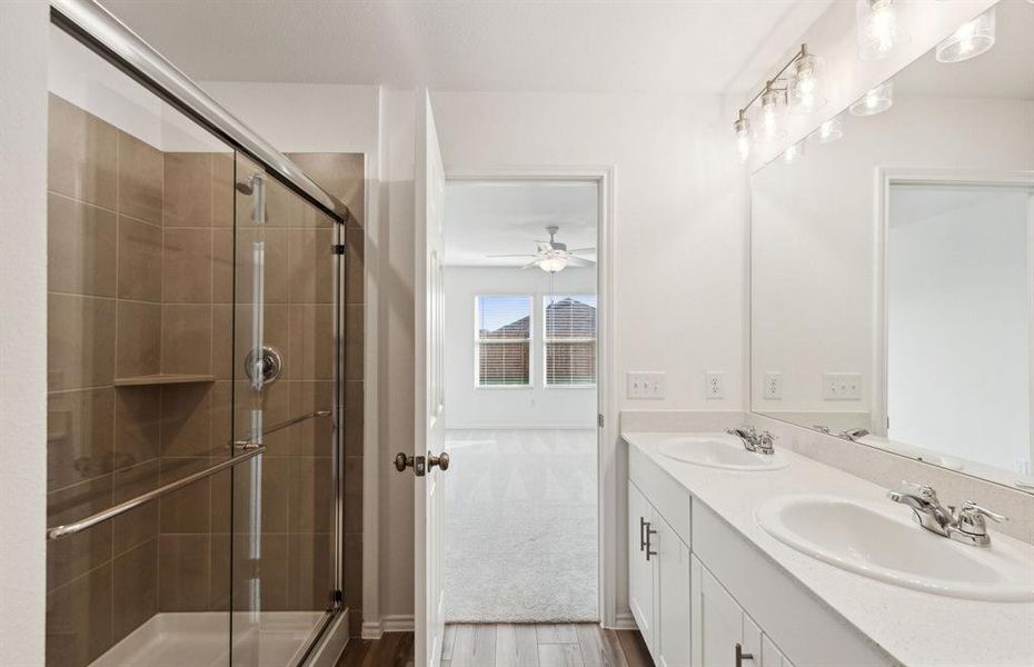 Owner's bath with dual sinks *real home pictured