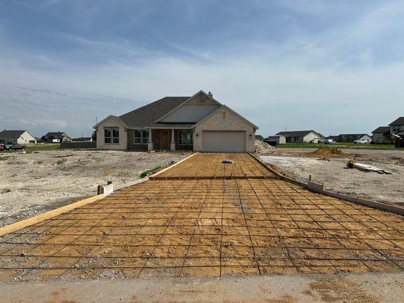 Front exterior of a new home in Hillcrest Meadows North, Decatur, TX, highlighting curb appeal (Image 1). Front exterior of a new home in Hillcrest Meadows North, Decatur, TX, highlighting curb appeal (Image 1).