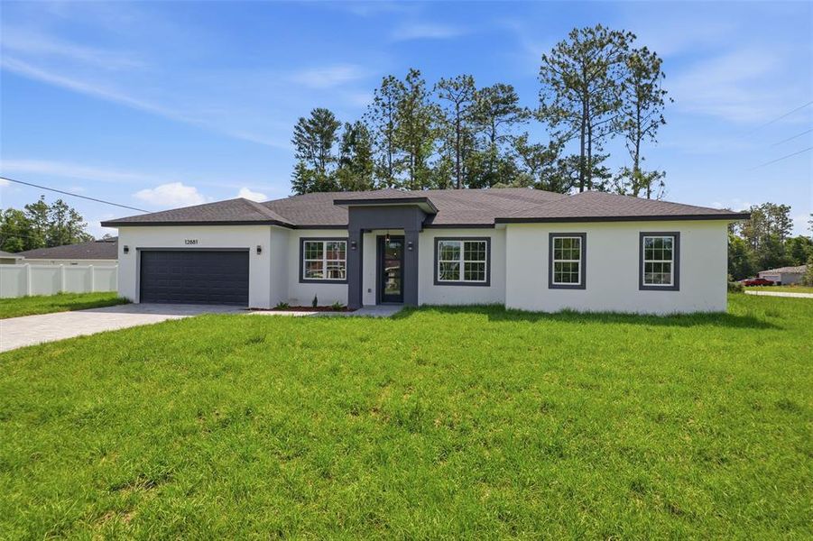 Front exterior of a new home in , Ocala, FL, highlighting curb appeal (Image 20). Front exterior of a new home in , Ocala, FL, highlighting curb appeal (Image 20).