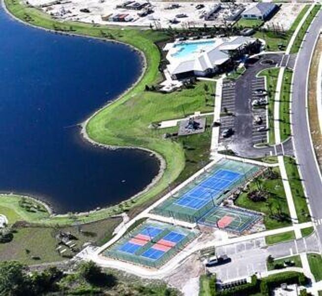 Front exterior of a new home in Highpointe, Stuart, FL, highlighting curb appeal (Image 21).