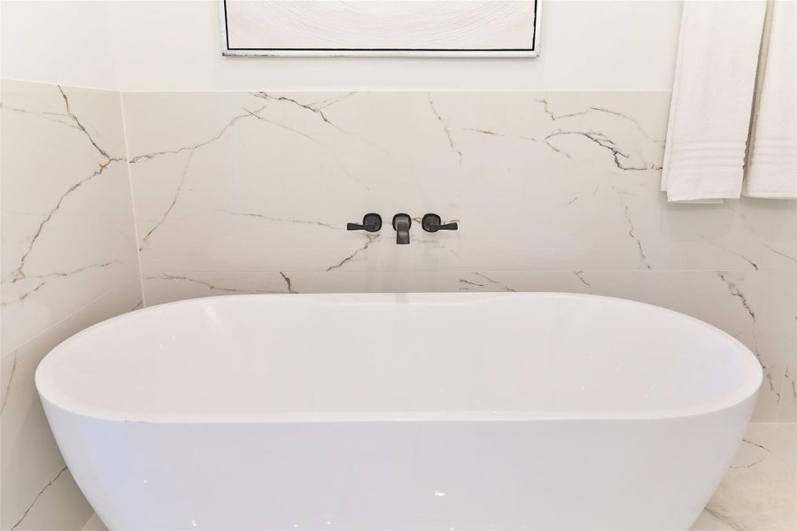 Expansive porcelain tiles enhance the bathroom's elegance, creating a serene, spa-like retreat perfect for relaxation. Expansive porcelain tiles enhance the bathroom's elegance, creating a serene, spa-like retreat perfect for relaxation.