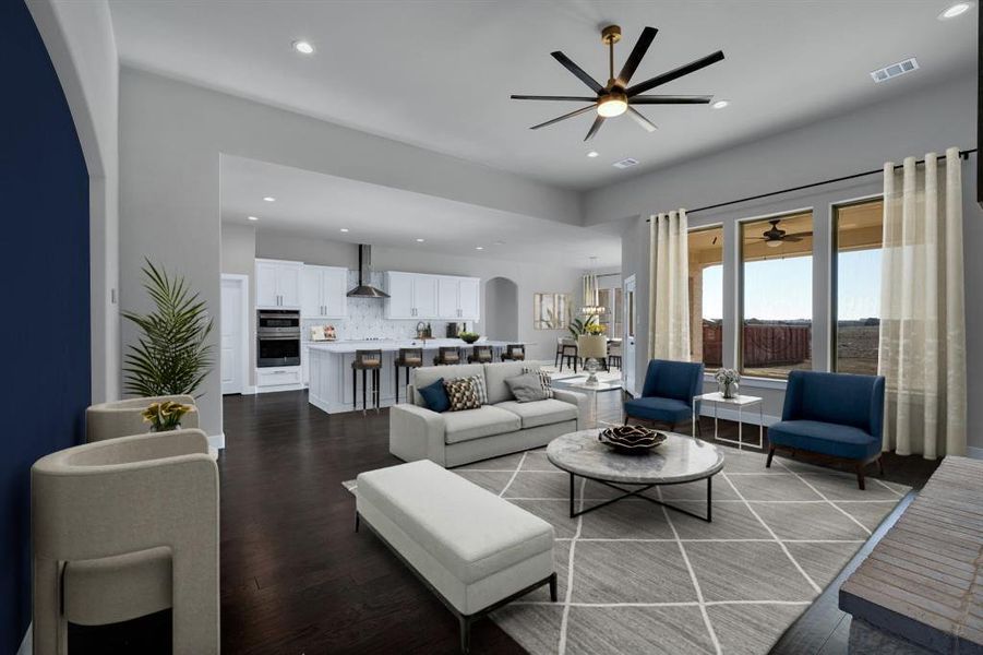 Living room featuring wood-type flooring and ceiling fan