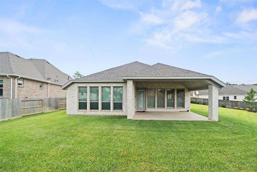 Front exterior of a new home in The Woodlands Hills 60', Willis, TX, highlighting curb appeal (Image 20). Front exterior of a new home in The Woodlands Hills 60', Willis, TX, highlighting curb appeal (Image 20).