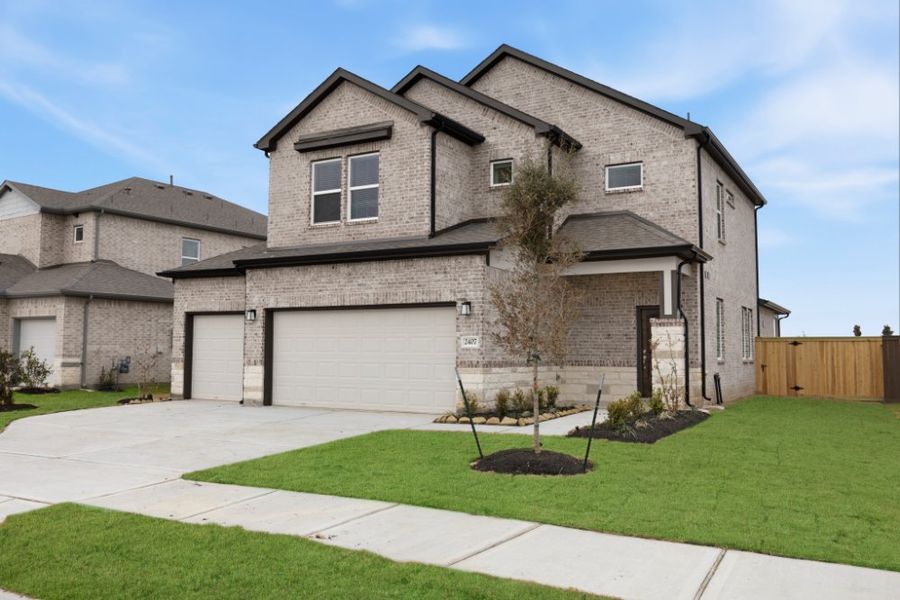 Front exterior of a new home in Creekhaven, Iowa Colony, TX, highlighting curb appeal (Image 19). Front exterior of a new home in Creekhaven, Iowa Colony, TX, highlighting curb appeal (Image 19).