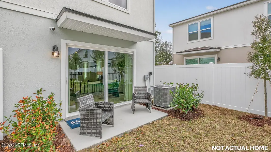 Exterior details and patio area of a home in Irongate Villas, Jacksonville (Image 4).