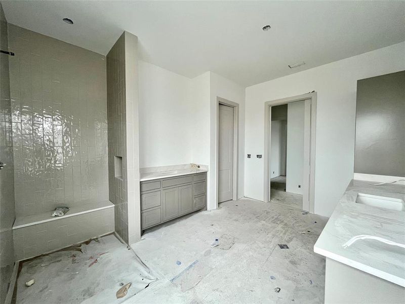 Bathroom featuring vanity and a bath