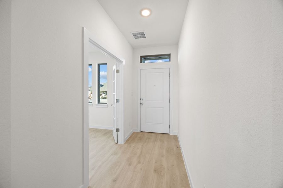 Entry in the Pearl home plan by Trophy Signature Homes – REPRESENTATIVE PHOTO