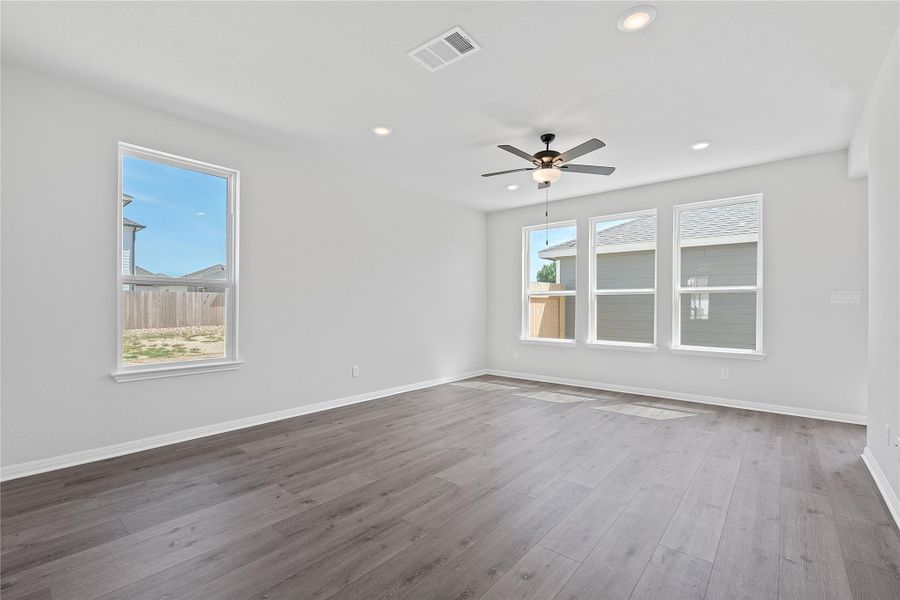 Empty room with wood finished floors, recessed lighting, and a ceiling fan