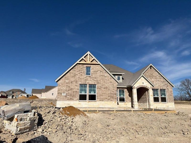 View of front facade featuring brick siding