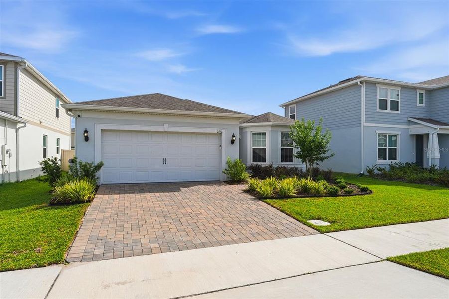 Front exterior of a new home in , Kissimmee, FL, highlighting curb appeal (Image 24).