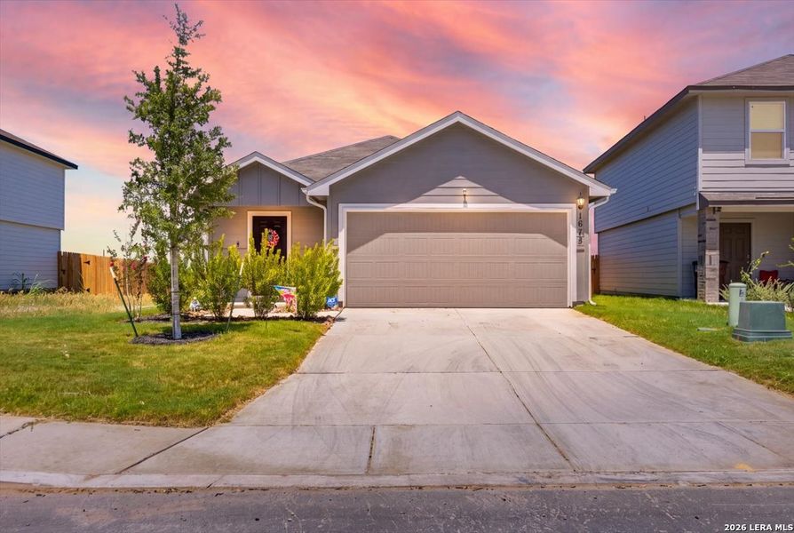 Front exterior of a new home in Redbird Ranch, San Antonio, TX, highlighting curb appeal (Image 2). Front exterior of a new home in Redbird Ranch, San Antonio, TX, highlighting curb appeal (Image 2).