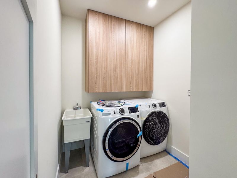 (as of April 8, 2026) the laundry room is located on the second level, easy access for all occupants, and includes a separate wash sink and storage