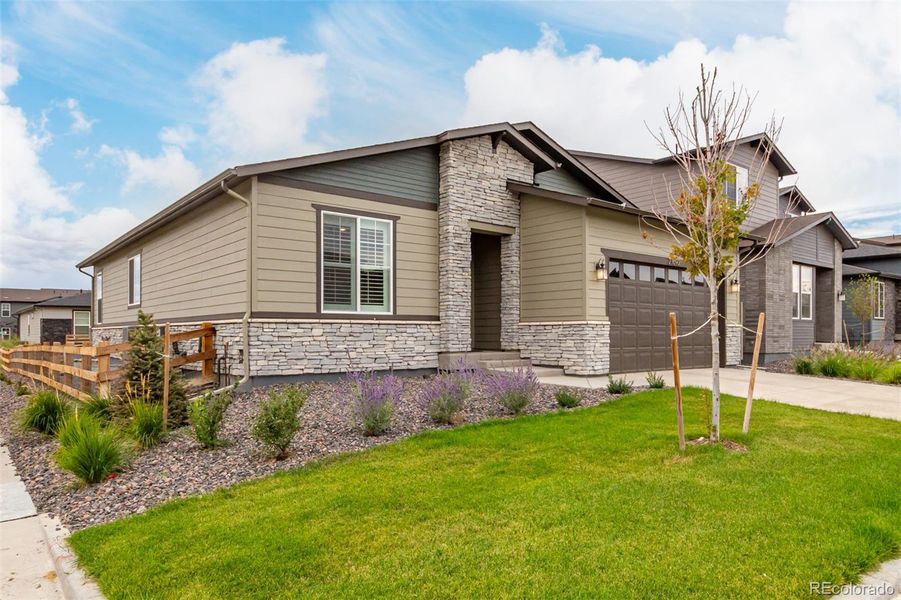 Front exterior of a new home in , Aurora, CO, highlighting curb appeal (Image 23).