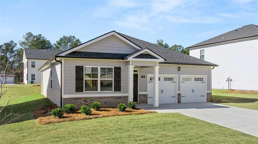 Front exterior of a new home in Oakchase at Hampton, Hampton, GA, highlighting curb appeal (Image 23).
