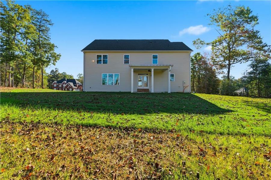 Exterior details and patio area of a home in The Estates at Hurricane Pointe, Douglasville (Image 25). Exterior details and patio area of a home in The Estates at Hurricane Pointe, Douglasville (Image 25).