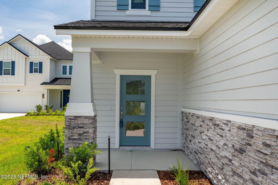 Front exterior of a new home in Beacon Lake, St. Augustine, FL, highlighting curb appeal (Image 34).