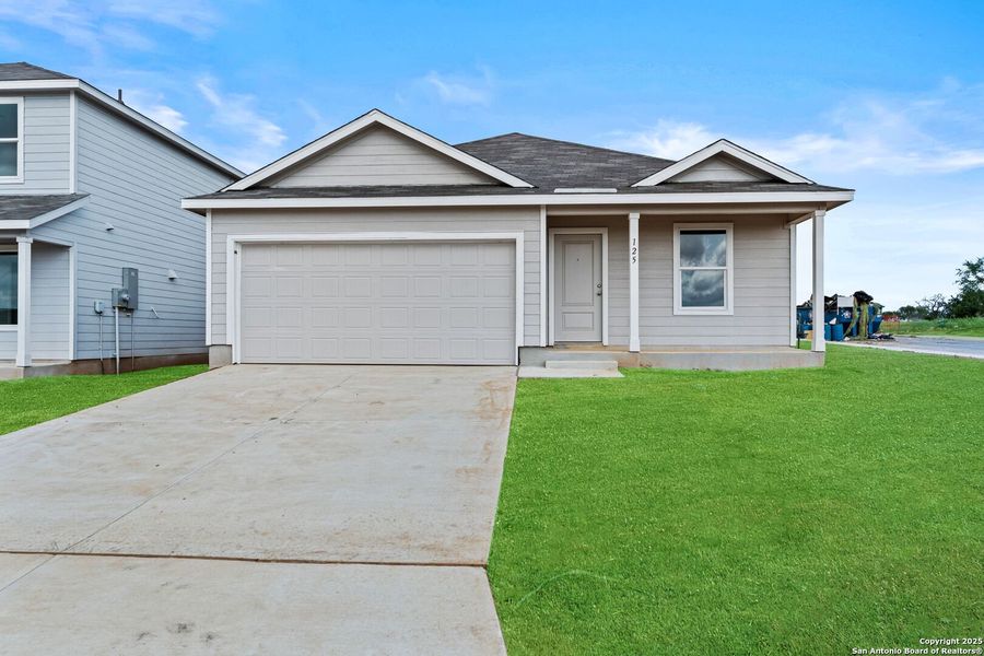 Front exterior of a new home in Lodi Grove, Floresville, TX, highlighting curb appeal (Image 2). Front exterior of a new home in Lodi Grove, Floresville, TX, highlighting curb appeal (Image 2).