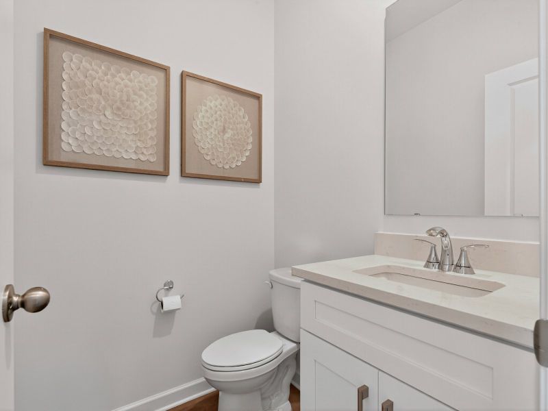 The half bathroom is conveniently located on the first floor for guests.