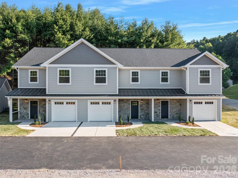 Front exterior of a new home in , Burnsville, NC, highlighting curb appeal (Image 15).