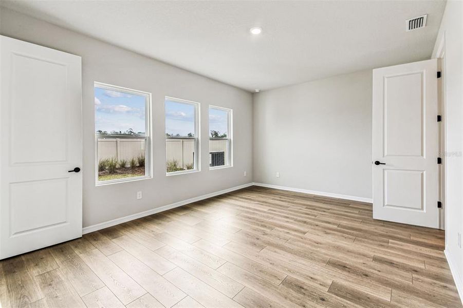 Spacious, unfurnished interior of a new home in Oakfield at Mount Dora Village Series, Mount Dora (Image 32).