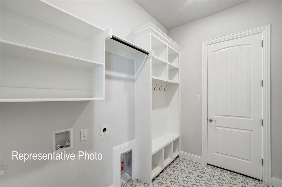 Mudroom with light tile floors