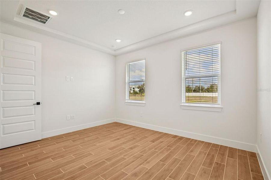 Spacious, unfurnished interior of a new home in Magnolia Bay - Reserve Series, Nokomis (Image 30).