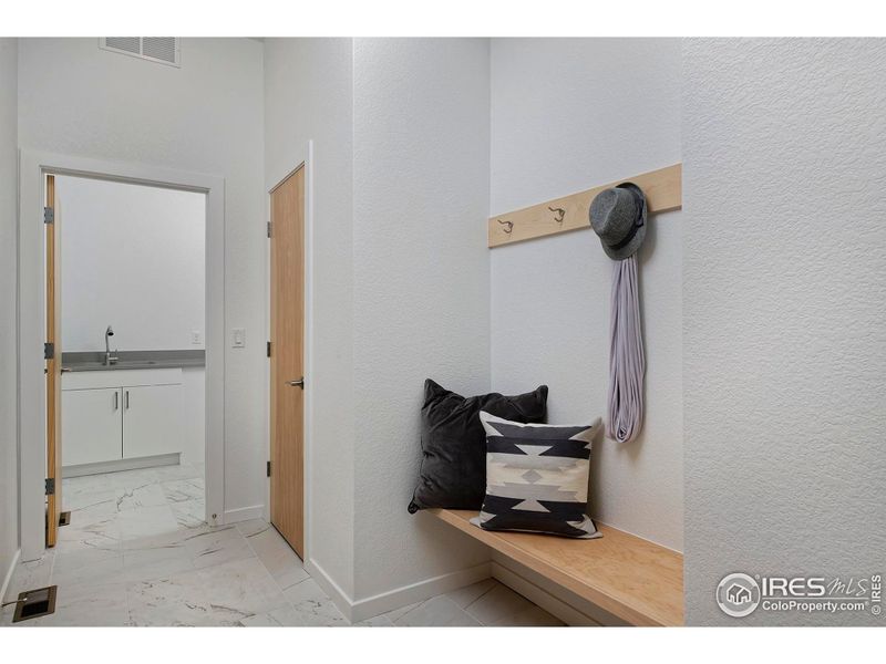 Owners entry features coat closet & bench with hoods Owners entry features coat closet & bench with hoods
