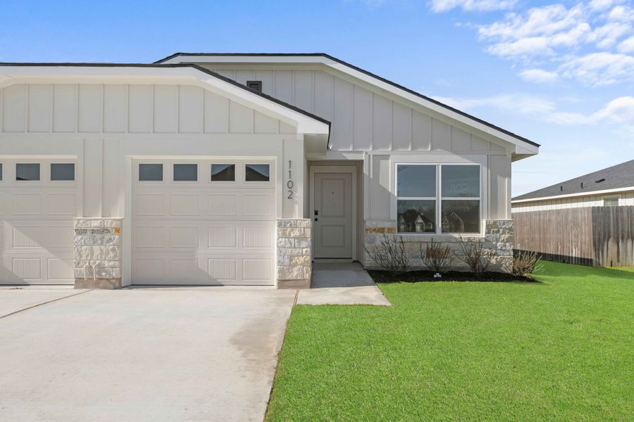 Front exterior of a new home in College Park Townhomes, Troy, TX, highlighting curb appeal (Image 1). Front exterior of a new home in College Park Townhomes, Troy, TX, highlighting curb appeal (Image 1).