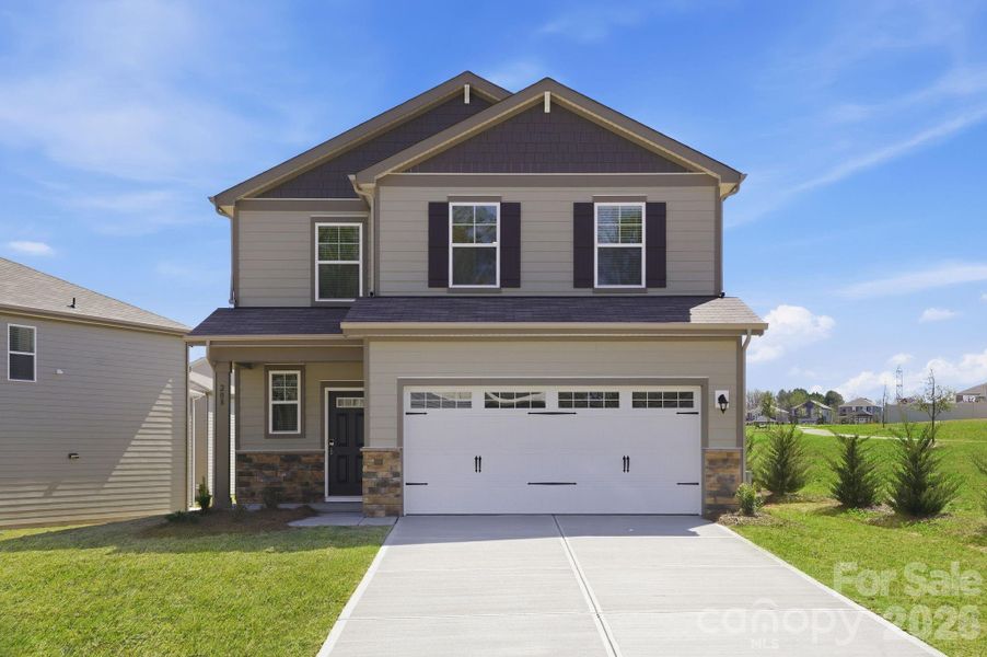 Front exterior of a new home in The Meadows at Asbury Ridge, York, SC, highlighting curb appeal (Image 1). Front exterior of a new home in The Meadows at Asbury Ridge, York, SC, highlighting curb appeal (Image 1).