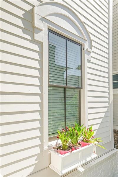 Exterior details and patio area of a home in Manning on the Square, Alpharetta (Image 25).