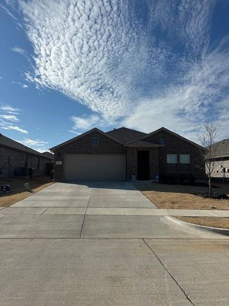 Front exterior of a new home in Sculptor's Park, Springtown, TX, highlighting curb appeal (Image 1). Front exterior of a new home in Sculptor's Park, Springtown, TX, highlighting curb appeal (Image 1).