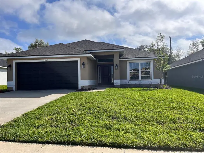 Front exterior of a new home in Abbey Glen, Dade City, FL, highlighting curb appeal (Image 2). Front exterior of a new home in Abbey Glen, Dade City, FL, highlighting curb appeal (Image 2).