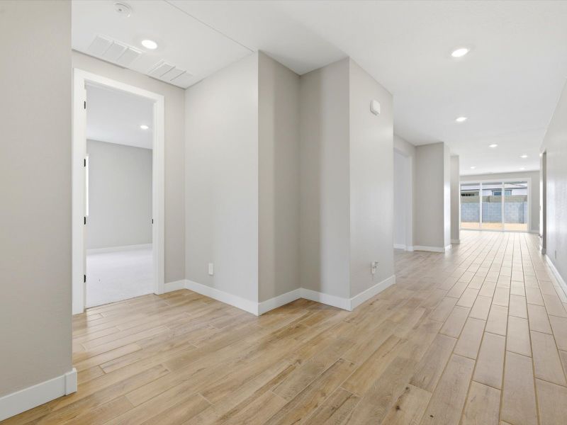 Spacious, unfurnished interior of a new home in White Tank Foothills Signature Series, Waddell (Image 12).