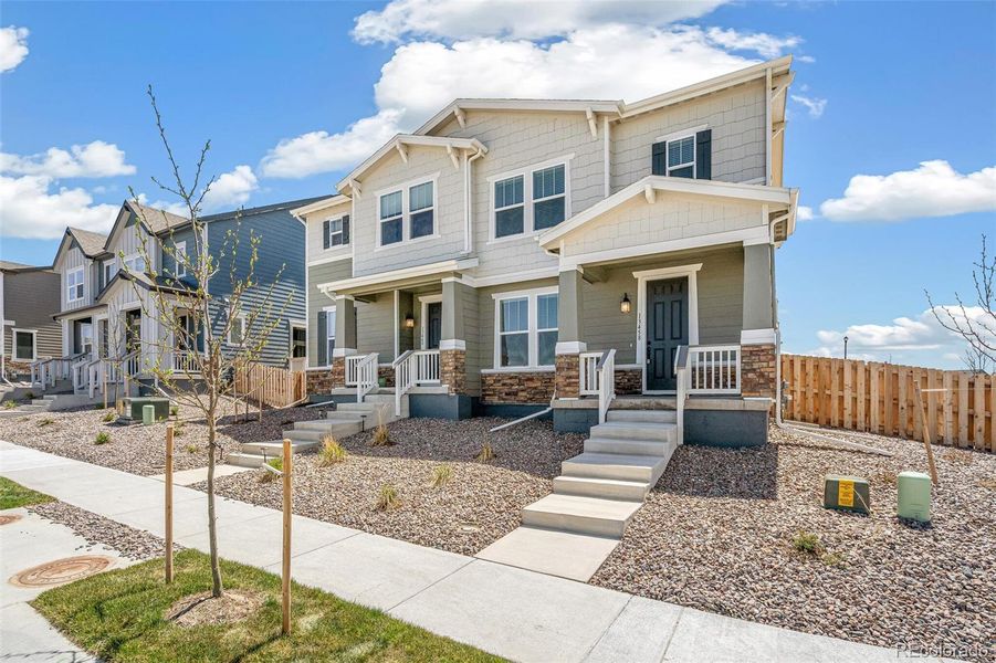 Front exterior of a new home in Turnberry, Commerce City, CO, highlighting curb appeal (Image 25). Front exterior of a new home in Turnberry, Commerce City, CO, highlighting curb appeal (Image 25).