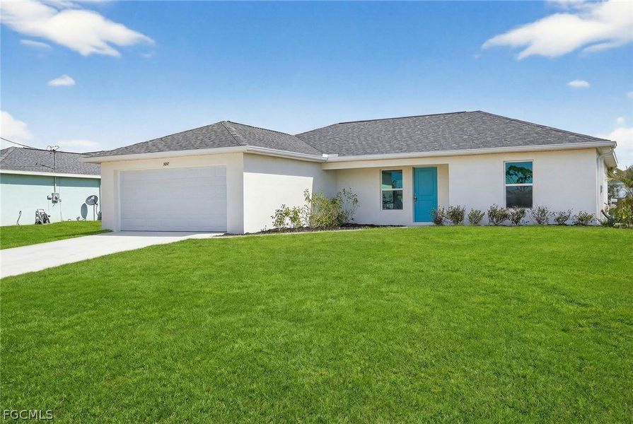 Front exterior of a new home in Cape Coral, Cape Coral, FL, highlighting curb appeal (Image 1). Front exterior of a new home in Cape Coral, Cape Coral, FL, highlighting curb appeal (Image 1).