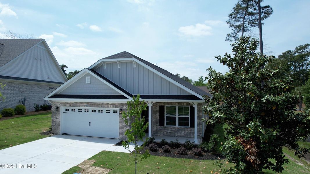 Front exterior of a new home in Palmetto Creek, Bolivia, NC, highlighting curb appeal (Image 12).