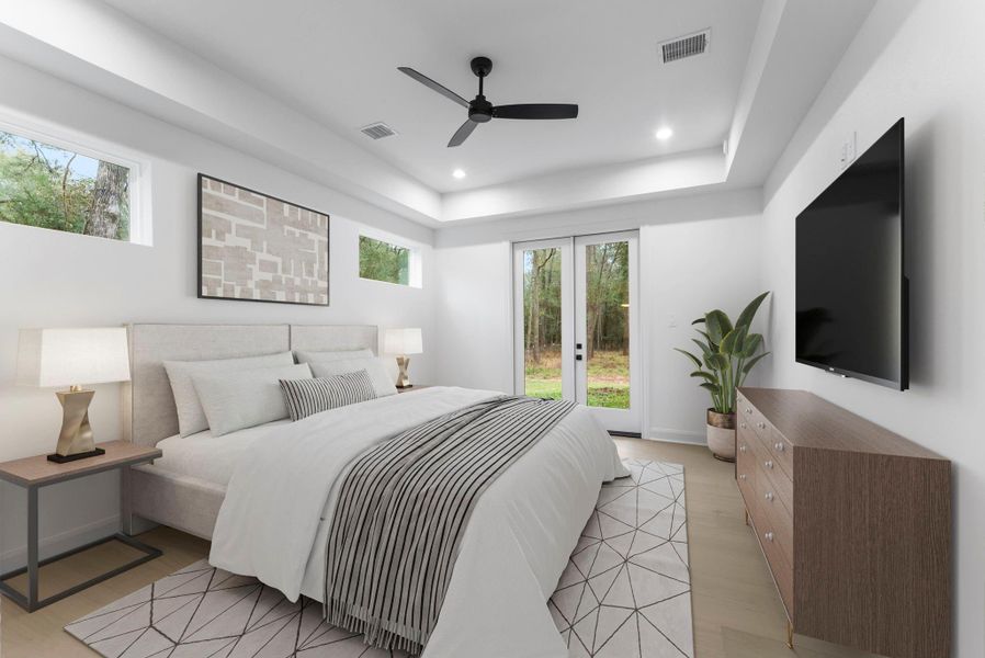 The primary bedroom overlooks the backyard and has its own patio.