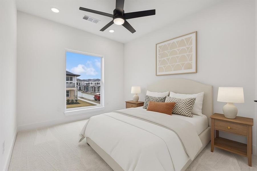 Carpeted bedroom with ceiling fan and recessed lighting
