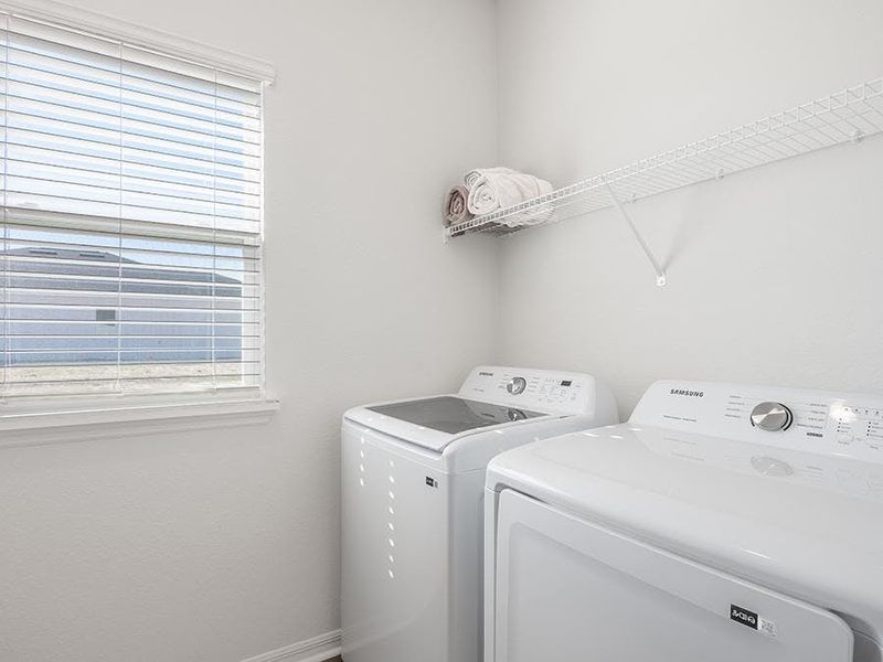 A dedicated laundry room keeps the wash out of sight - Monroe by Highland Homes