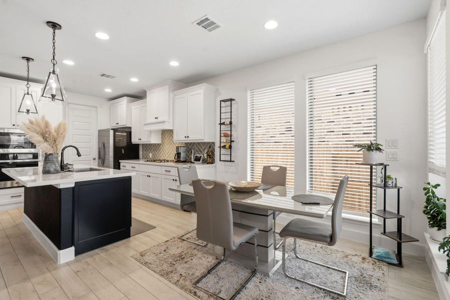 Bright dining area positioned conveniently adjacent to the kitchen and living spaces