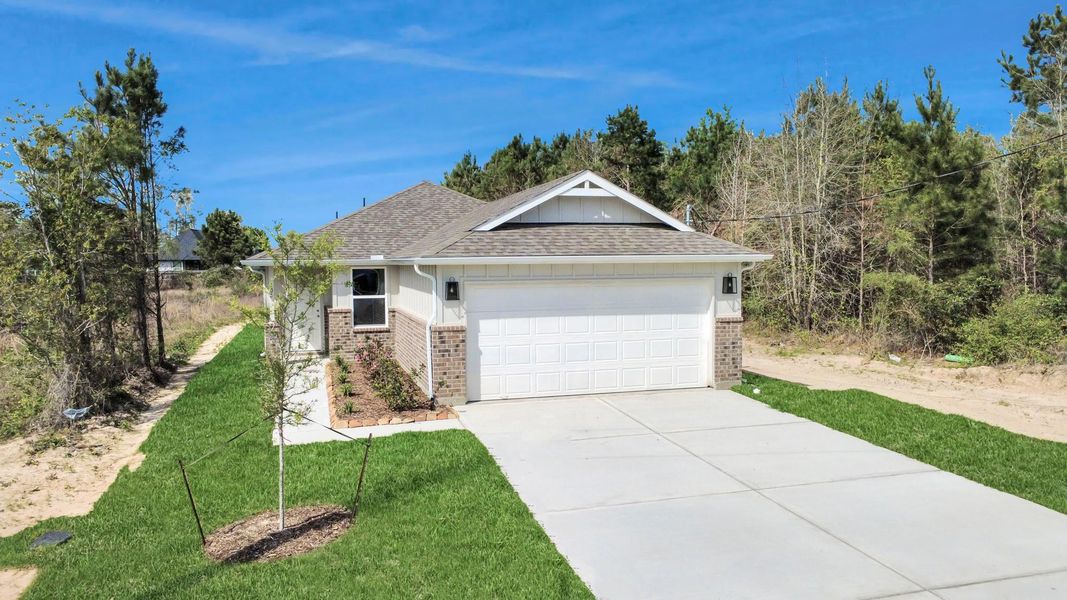 Front exterior of a new home in Santa Fe, Cleveland, TX, highlighting curb appeal (Image 21).