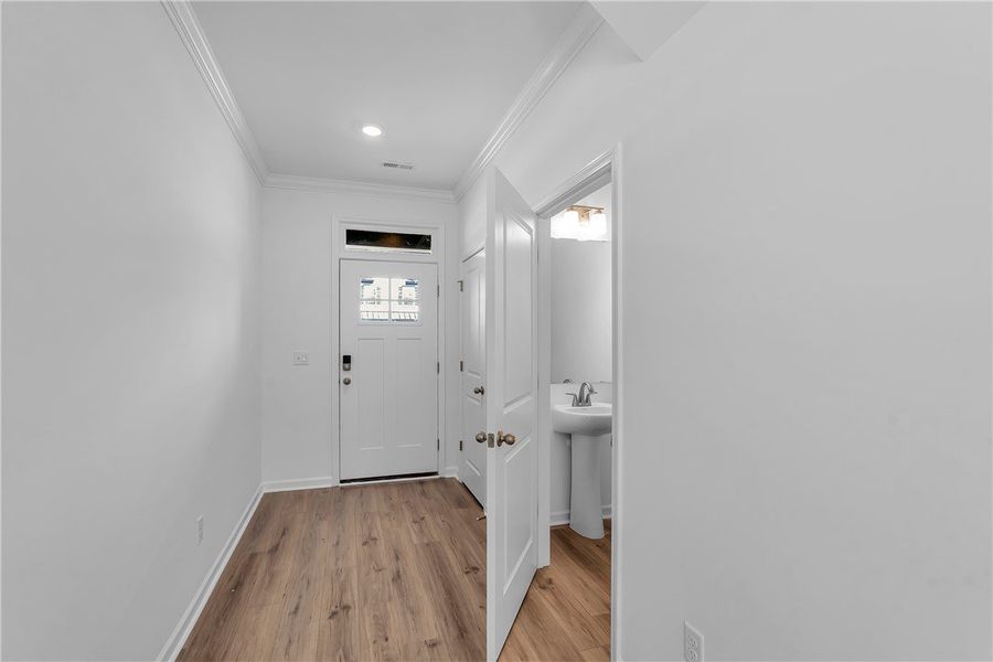 This bright entry features durable flooring, leadi