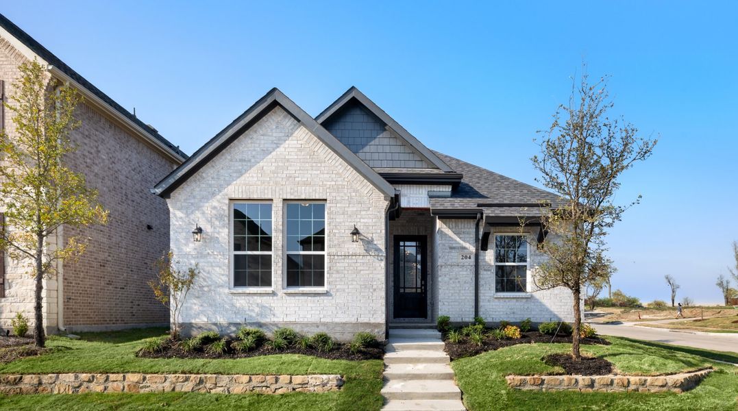 Representative exterior photo of a completed home built from the Hawthorne by UnionMain Homes in Edgewater, Fate, TX (Image 21).