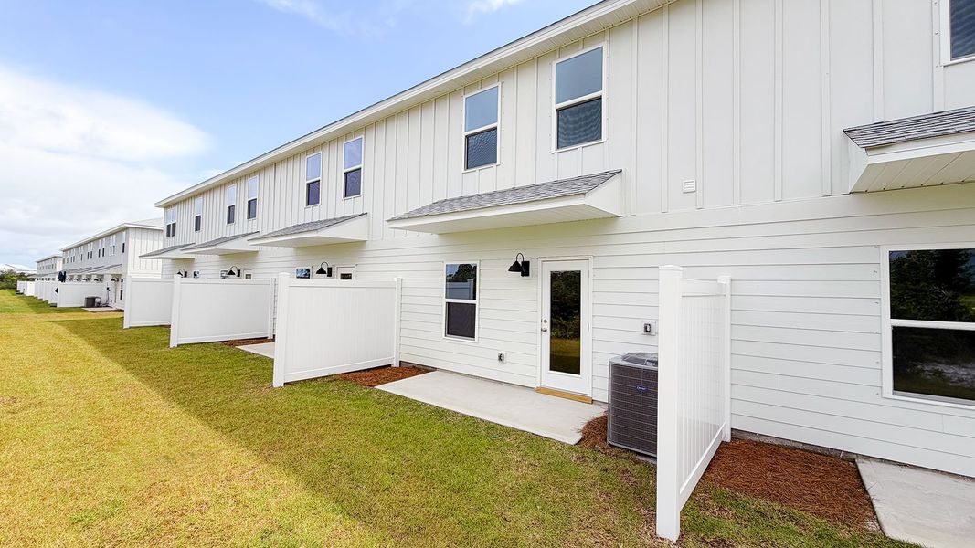 Exterior details and patio area of a home in Salt Creek Townhomes at Mexico Beach, Mexico Beach (Image 4). Exterior details and patio area of a home in Salt Creek Townhomes at Mexico Beach, Mexico Beach (Image 4).