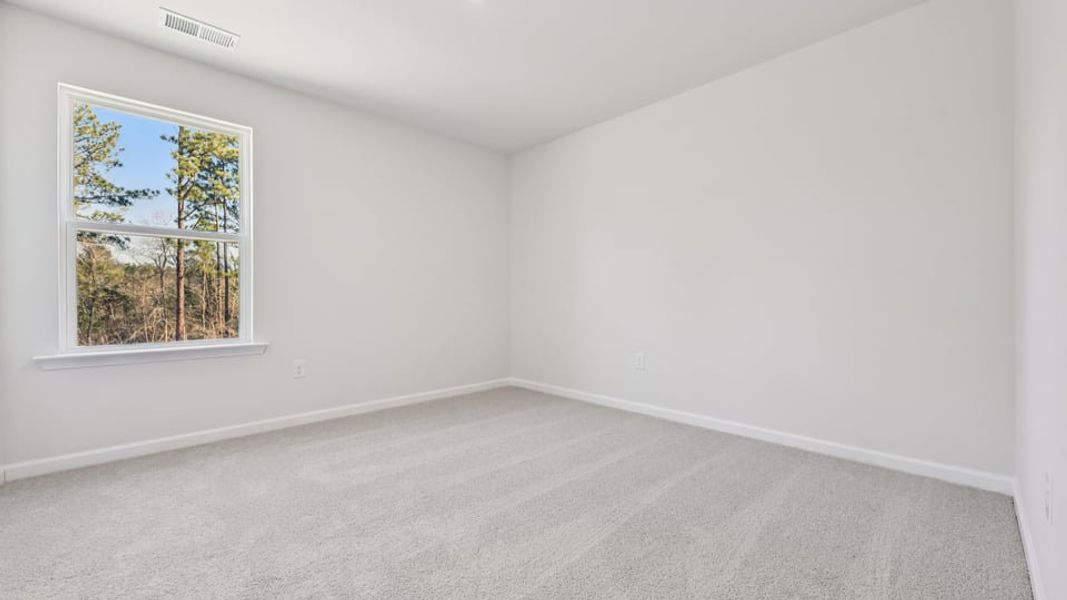 Spacious, unfurnished interior of a new home in Gretchen Pines, West End (Image 19).