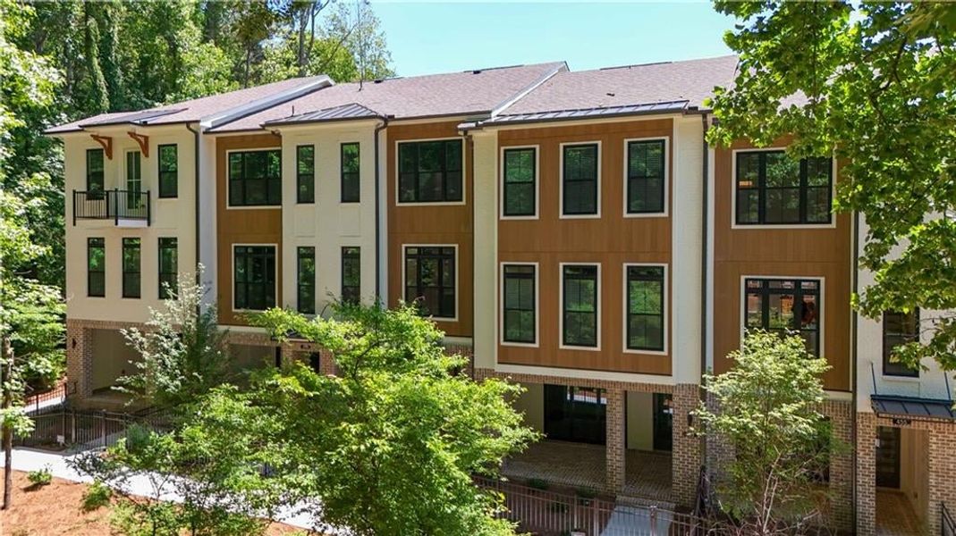 Whether relaxing indoors or outdoors, the natural setting enhances the home's peaceful charm.