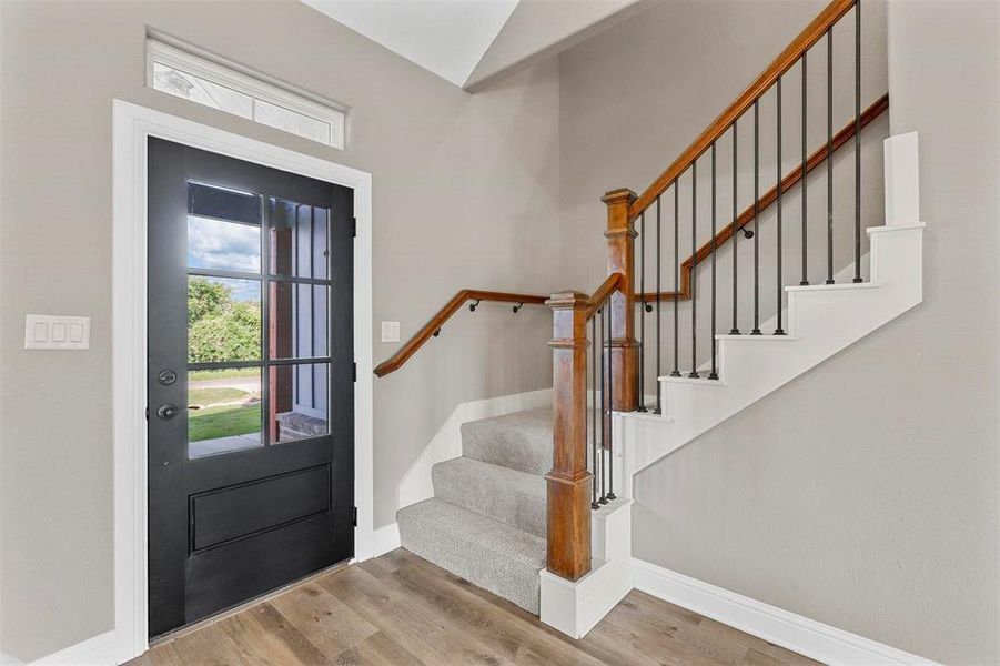 Entrance foyer featuring light hardwood / wood-style flooring