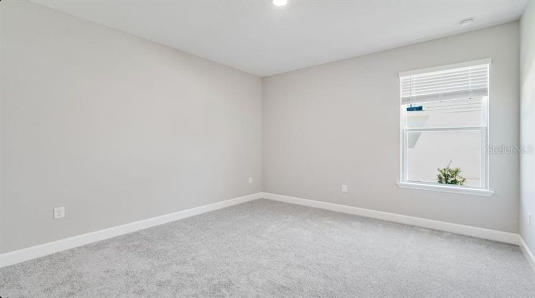 Spacious, unfurnished interior of a new home in The Cove at West Port, Port Charlotte (Image 25).