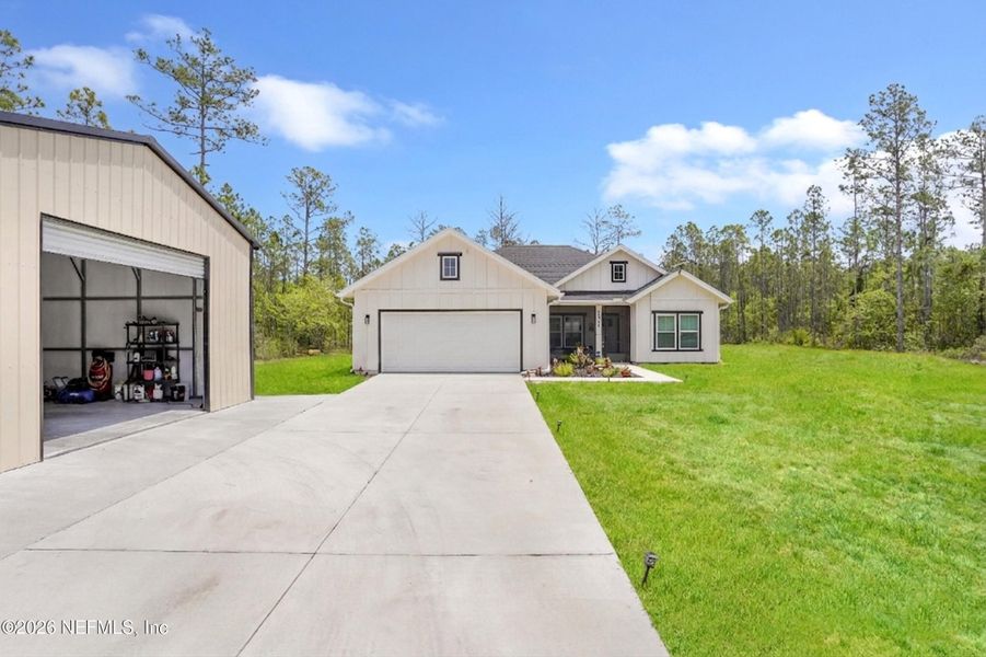 Front exterior of a new home in , Hastings, FL, highlighting curb appeal (Image 22).