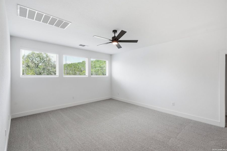 Spacious, unfurnished interior of a new home in The Reserve at Potranco Oaks, Castroville (Image 39).